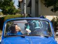 President Judy K. Sakaki with Lobo inside of Super Beetle