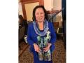 President Judy Sakaki holding her NASPA award