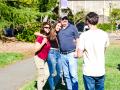 A family poses with their daughter at Welcome Weekend 