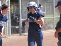 softball players celebrating home run