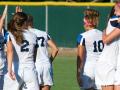 women's soccer celebrating goal